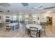 Spacious clubhouse featuring tables, chairs, fireplace and abundant natural light at 4208 Boston Cir, New Port Richey, FL 34653