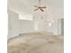 Bright living room featuring a ceiling fan, and a view into another room at 4208 Boston Cir, New Port Richey, FL 34653