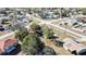 This aerial photo showcases the neighborhood with mature trees, and houses with various roof colors at 4560 Lamson Ave, Spring Hill, FL 34608
