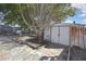 Metal shed in a fenced backyard with shade tree at 4560 Lamson Ave, Spring Hill, FL 34608