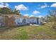 Quaint backyard featuring a patio set and well-maintained lawn for outdoor enjoyment at 4560 Lamson Ave, Spring Hill, FL 34608