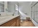 Bathroom featuring a double vanity, a shower/tub and wood look floors at 4560 Lamson Ave, Spring Hill, FL 34608