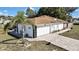 Features a brick-paved driveway, attached garage, and decorative exterior elements at 4560 Lamson Ave, Spring Hill, FL 34608