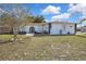 Charming single-story home featuring a well-kept lawn and a decorative front entrance at 4560 Lamson Ave, Spring Hill, FL 34608