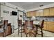 Kitchen island with granite countertops and barstool seating at 4560 Lamson Ave, Spring Hill, FL 34608