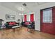 Features stylish couches, red accents, and a cozy interior design at 4560 Lamson Ave, Spring Hill, FL 34608