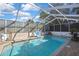 Screened in pool with chairs and table at 4560 Lamson Ave, Spring Hill, FL 34608
