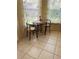 Breakfast nook featuring tile floors, a breakfast table and chair at 5042 Muriel Ln, New Port Richey, FL 34653