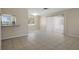 Bright living room with tile flooring, neutral walls, and natural light at 520 Copperfield Rd, Spring Hill, FL 34606