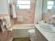 Cozy bathroom with tub, shower, and traditional fixtures at 5441 Mosaic Dr, Holiday, FL 34690