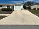 Wide driveway leading to the attached garage of a well-maintained single-story home at 5441 Mosaic Dr, Holiday, FL 34690