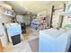 Functional garage with washer, dryer, and ample storage space for tools and equipment at 5441 Mosaic Dr, Holiday, FL 34690
