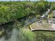 Scenic aerial view of a tranquil river with kayakers enjoying a sunny day surrounded by lush greenery at 6090 Waverly Rd, Weeki Wachee, FL 34607