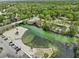 Amazing aerial shot of a waterfront with a beach, a restaurant, and lush greenery with parking at 6090 Waverly Rd, Weeki Wachee, FL 34607
