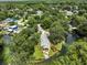 Beautiful aerial shot of home, landscaping, and river access showing ideal location at 6090 Waverly Rd, Weeki Wachee, FL 34607