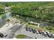 Scenic aerial view of a riverfront with boat ramp and parking, surrounded by lush greenery at 6090 Waverly Rd, Weeki Wachee, FL 34607