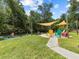 River view of the property with people enjoying the water activities on a beautiful sunny day at 6090 Waverly Rd, Weeki Wachee, FL 34607