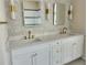 Bright bathroom featuring double sinks, quartz countertops and hexagon backsplash tile at 6393 Pinehurst Dr, Spring Hill, FL 34606
