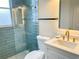 Modern bathroom with a glass-enclosed shower, stylish tiles, and updated fixtures at 6393 Pinehurst Dr, Spring Hill, FL 34606