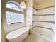 A luxurious bathtub and walk-in shower offer a relaxing experience with stylish fixtures and details at 6393 Pinehurst Dr, Spring Hill, FL 34606