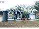 Charming single-Gathering home with well-maintained landscaping, a two car garage, and a freshly painted exterior at 6393 Pinehurst Dr, Spring Hill, FL 34606
