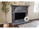 The grey fireplace has some decoration around it at 6393 Pinehurst Dr, Spring Hill, FL 34606