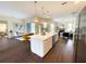 Open-concept kitchen featuring a large center island and seamless transition to living area at 6393 Pinehurst Dr, Spring Hill, FL 34606