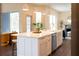 Spacious kitchen island featuring a white countertop, modern faucet, and cabinetry at 6393 Pinehurst Dr, Spring Hill, FL 34606