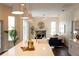 Bright kitchen island with a white countertop, seating, and stainless steel appliances at 6393 Pinehurst Dr, Spring Hill, FL 34606