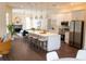 Bright, open kitchen with white cabinets, large island and stainless steel appliances at 6393 Pinehurst Dr, Spring Hill, FL 34606
