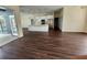 Open concept kitchen and living space with a center island and stainless appliances at 6393 Pinehurst Dr, Spring Hill, FL 34606