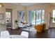 Bright living room boasts modern decor, sliding glass doors to pool, and seamless indoor-outdoor living at 6393 Pinehurst Dr, Spring Hill, FL 34606