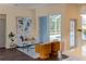 Modern living room featuring stylish furniture and a sliding glass door to the pool area at 6393 Pinehurst Dr, Spring Hill, FL 34606