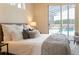 Comfortable main bedroom featuring a plush bed, a sliding glass door to the pool area at 6393 Pinehurst Dr, Spring Hill, FL 34606