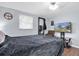 Relaxing bedroom featuring a comfortable bed with mounted television providing a cozy retreat at 7037 Green St, New Port Richey, FL 34652
