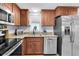 Well-equipped kitchen featuring stainless steel appliances and updated cabinets at 7037 Green St, New Port Richey, FL 34652