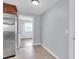 Galley kitchen with stainless steel appliances and an adjacent bonus room at 7037 Green St, New Port Richey, FL 34652