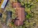 Stunning aerial view of the condo's red-tiled roof surrounded by lush greenery and a parking lot at 7650 Forest Trl # 7, Port Richey, FL 34668