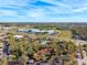 Aerial view of the condo with a lush green neighborhood and a highway nearby at 7650 Forest Trl # 7, Port Richey, FL 34668