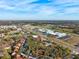 Expansive aerial view showcasing the community's convenient location near schools and local amenities at 7650 Forest Trl # 7, Port Richey, FL 34668