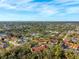 Aerial view of the condo featuring lush surroundings, a lake, and single Gathering home neighborhood at 7650 Forest Trl # 7, Port Richey, FL 34668