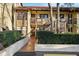 Charming condo featuring stone accents and a tiled roof, complemented by lush landscaping and a private entrance at 7650 Forest Trl # 7, Port Richey, FL 34668