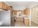 Traditional kitchen featuring wood cabinets, tile floors, and stainless steel appliances at 7650 Forest Trl # 7, Port Richey, FL 34668
