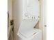 Convenient stacked washer and dryer setup in the laundry area, making laundry tasks more efficient at 7650 Forest Trl # 7, Port Richey, FL 34668