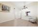 Living room featuring vaulted ceilings and a view into the kitchen area at 7650 Forest Trl # 7, Port Richey, FL 34668