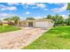 Inviting front of a single-story home with a brick driveway, green lawn, and a well-kept facade at 8017 Shepherd Ave, Spring Hill, FL 34606