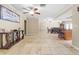 Open-concept living room with tile floors, a ceiling fan, and elegant furnishings at 8017 Shepherd Ave, Spring Hill, FL 34606