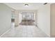 Neutral dining area with tile flooring, ample natural light, and a view to the patio at 8202 Woodsong Row, Hudson, FL 34667