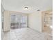 Bright dining area featuring tile flooring and sliding glass doors to backyard at 8202 Woodsong Row, Hudson, FL 34667