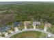 Scenic aerial view of homes in a beautiful neighborhood surrounded by lush greenery and natural wetlands at 8373 Maybelle Dr, Weeki Wachee, FL 34613